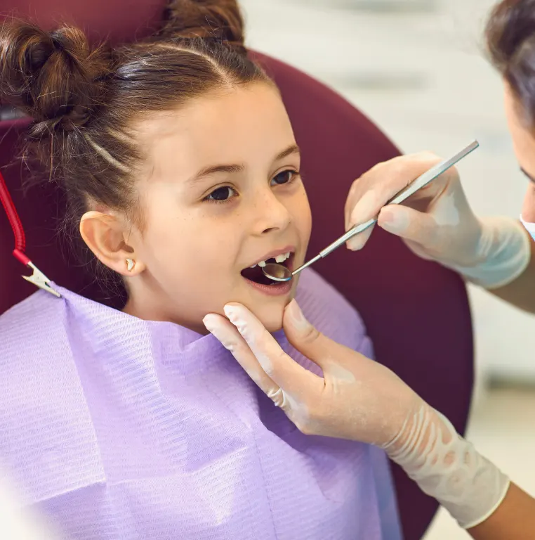 Child receiving preventive dental care at a family dental office in Flower Mound, TX